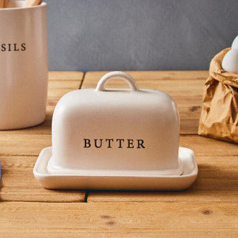 Orsina Farmhouse Cream Large Butter Dish – ceramic kitchen storage shown on a breakfast table with high-domed lid and ergonomic knob, displaying the timeless cream glaze and cottage farmhouse aesthetic