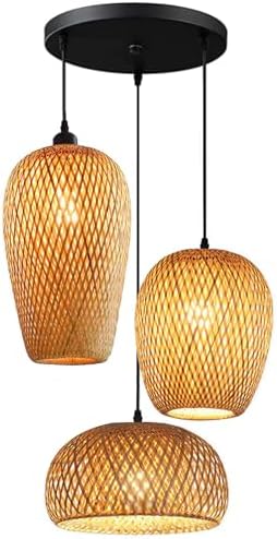 Bamboo rattan 3-light rustic wicker chandelier ceiling pendant light shown hanging in a dining room setting with warm Edison bulbs
