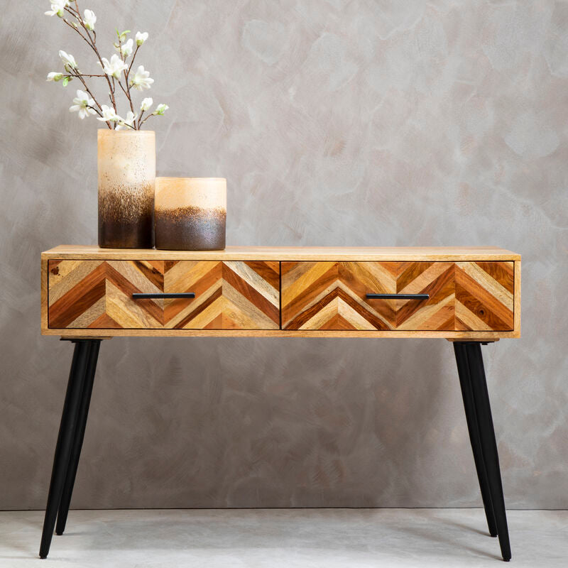 Orsina Mango Wood Console Table with 2-drawer chevron front and black iron legs — 115cm wide entryway table in warm natural mango wood with multi-tonal chevron pattern