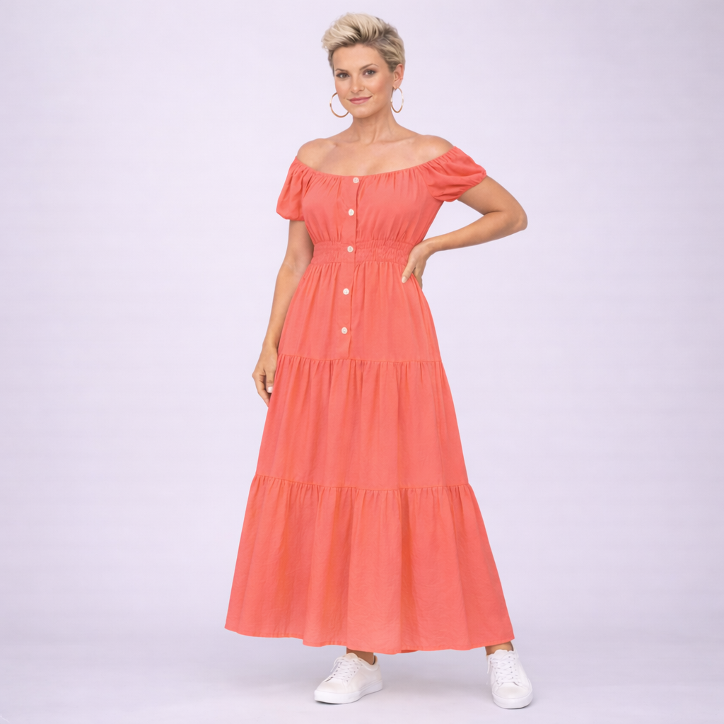 Woman wearing the RockThoseCurves Off Shoulder Elastic Waist Gypsy Style Maxi Dress in coral, standing confidently outdoors
