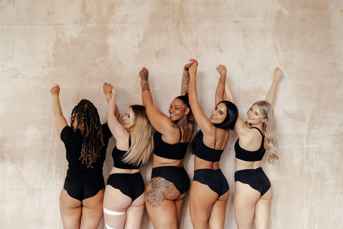 NIXI Body The Carla Black Leakproof Knicker Heavy — worn lifestyle shot showing the high leg VPL-free design and seamless waistband on a model, demonstrating the flattering fit and discreet absorbent gusset