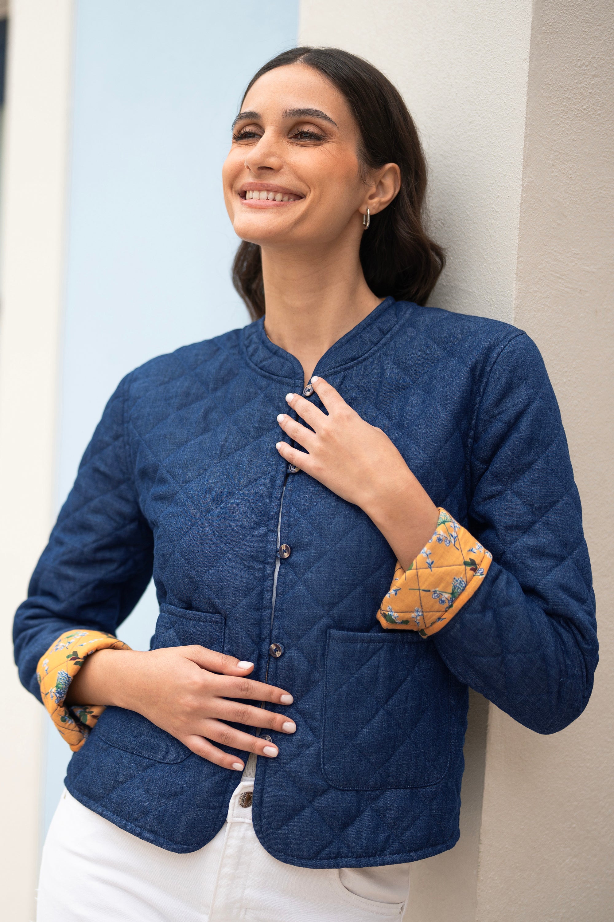 Yumi Blue Chambray Quilted Jacket with Reversible Floral Lining — 100% cotton fully reversible jacket showing the blue chambray quilted exterior, 59cm length, machine washable