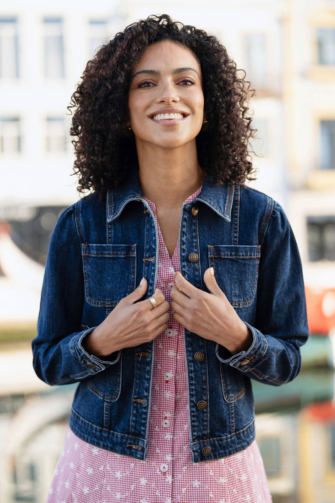 Yumi Blue Stretch Denim Jacket with Pocket Detail – classic fitted silhouette with front patch pockets and button closure, styled over a summer dress