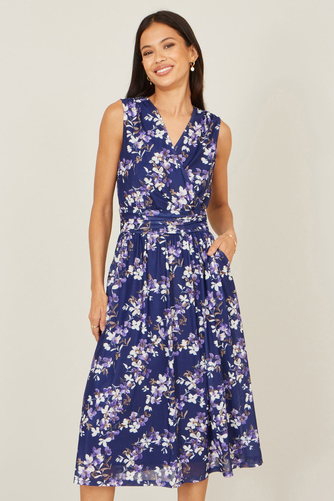 Yumi Navy Blossom Print Mesh Stretch Midi Dress with Pockets — front view showing the exclusive in-house blossom print, flattering skater silhouette, ruched waistline and midi length
