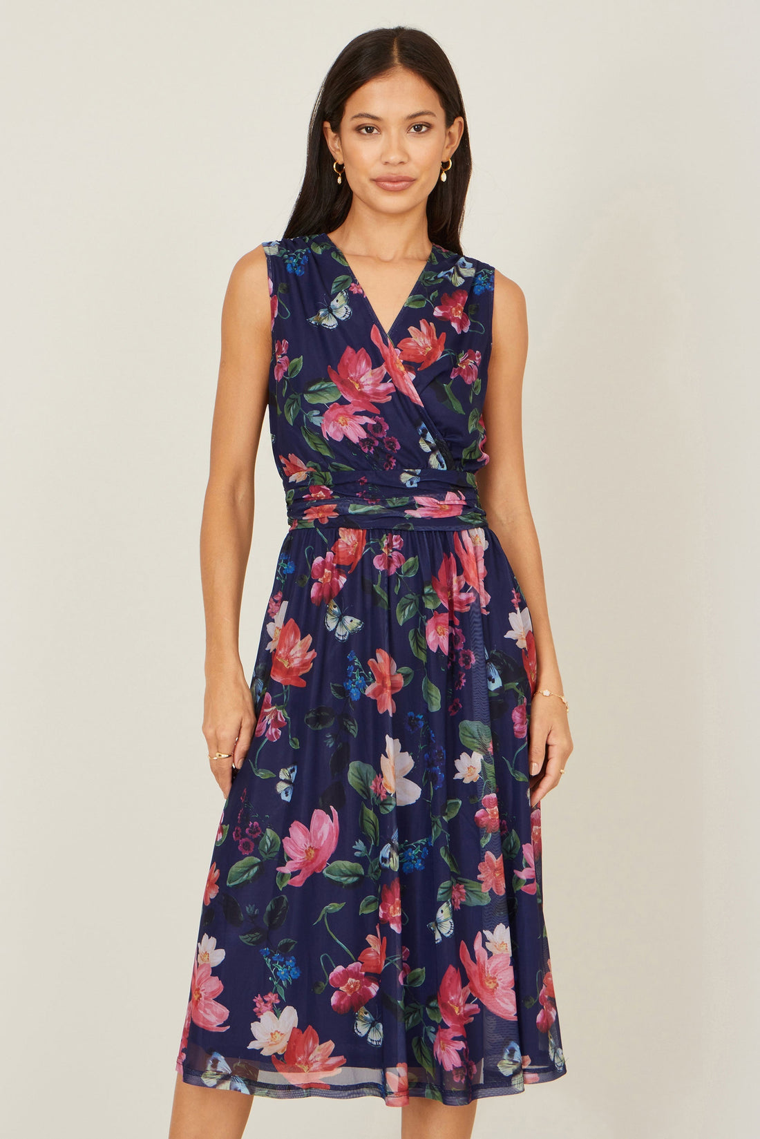 Yumi Navy Blurred Floral Print Mesh Stretch Midi Dress with Pockets — 94% polyester 6% elastane stretch mesh skater style midi dress with ruched waistline and pockets, 116cm length