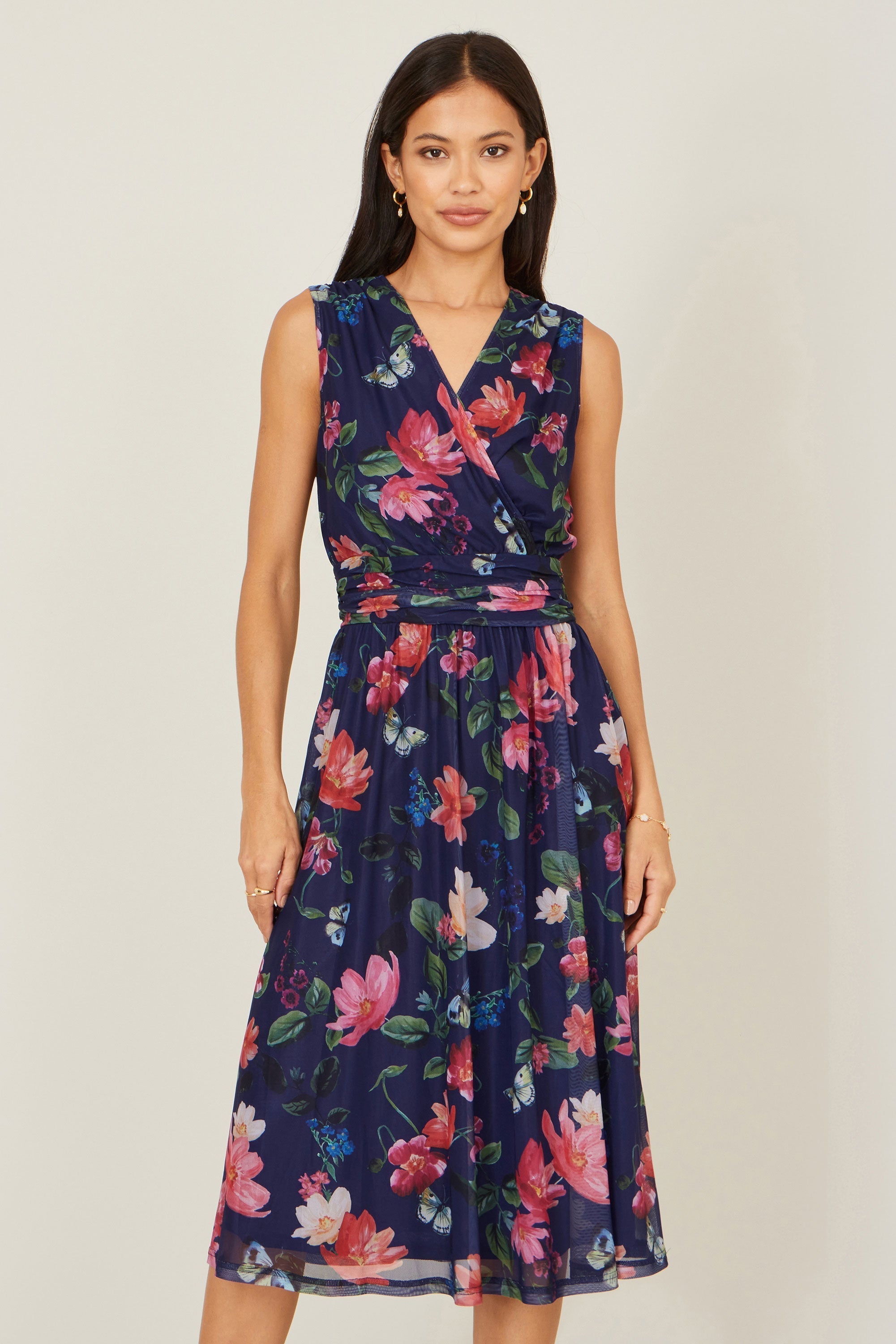 Yumi Navy Blurred Floral Print Mesh Stretch Midi Dress with Pockets — 94% polyester 6% elastane stretch mesh skater style midi dress with ruched waistline and pockets, 116cm length
