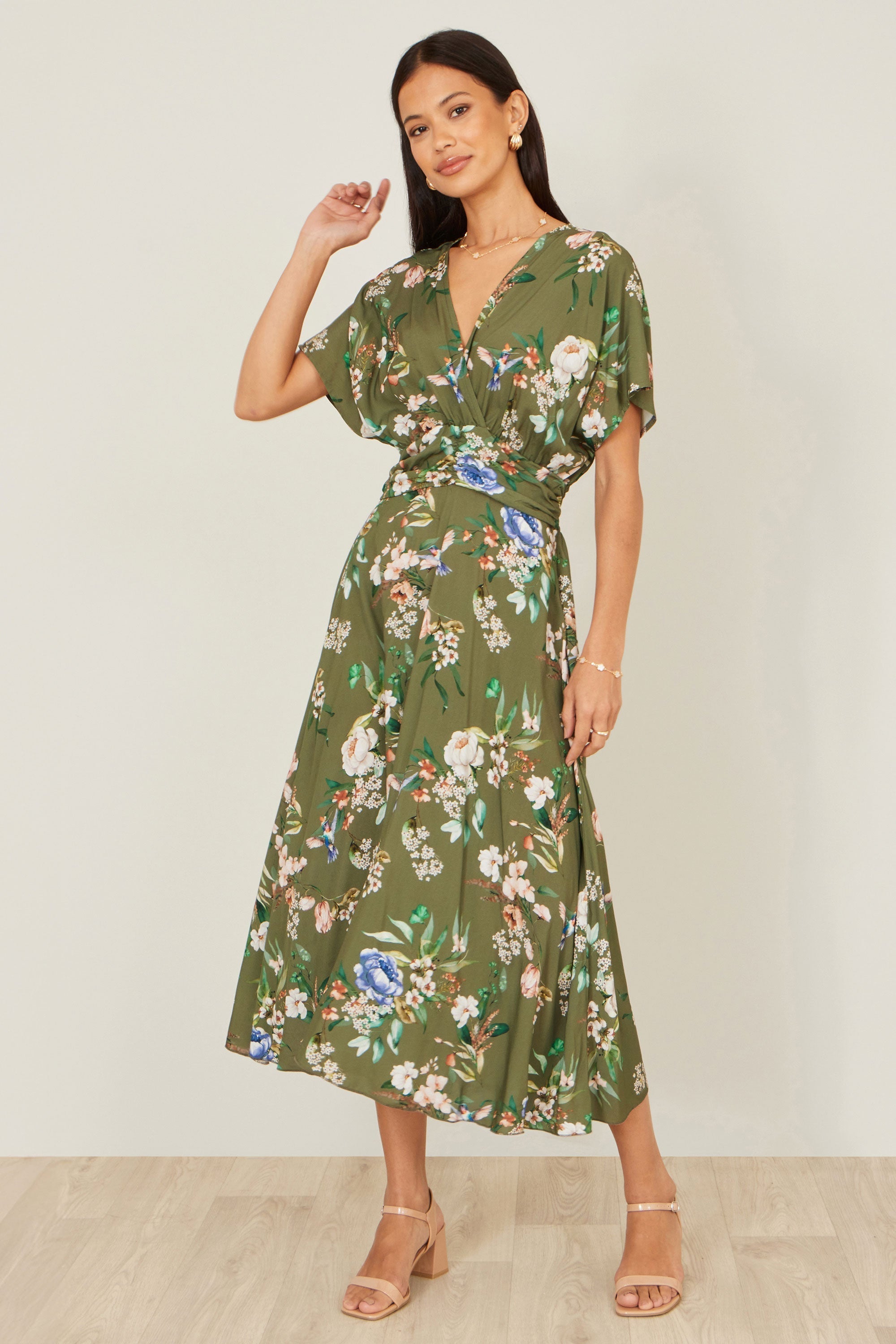 Yumi Sage Green Viscose Floral Print Midi Dress with ruched waist — painterly floral print on sage green base with wrap bodice V-neckline and A-line skirt