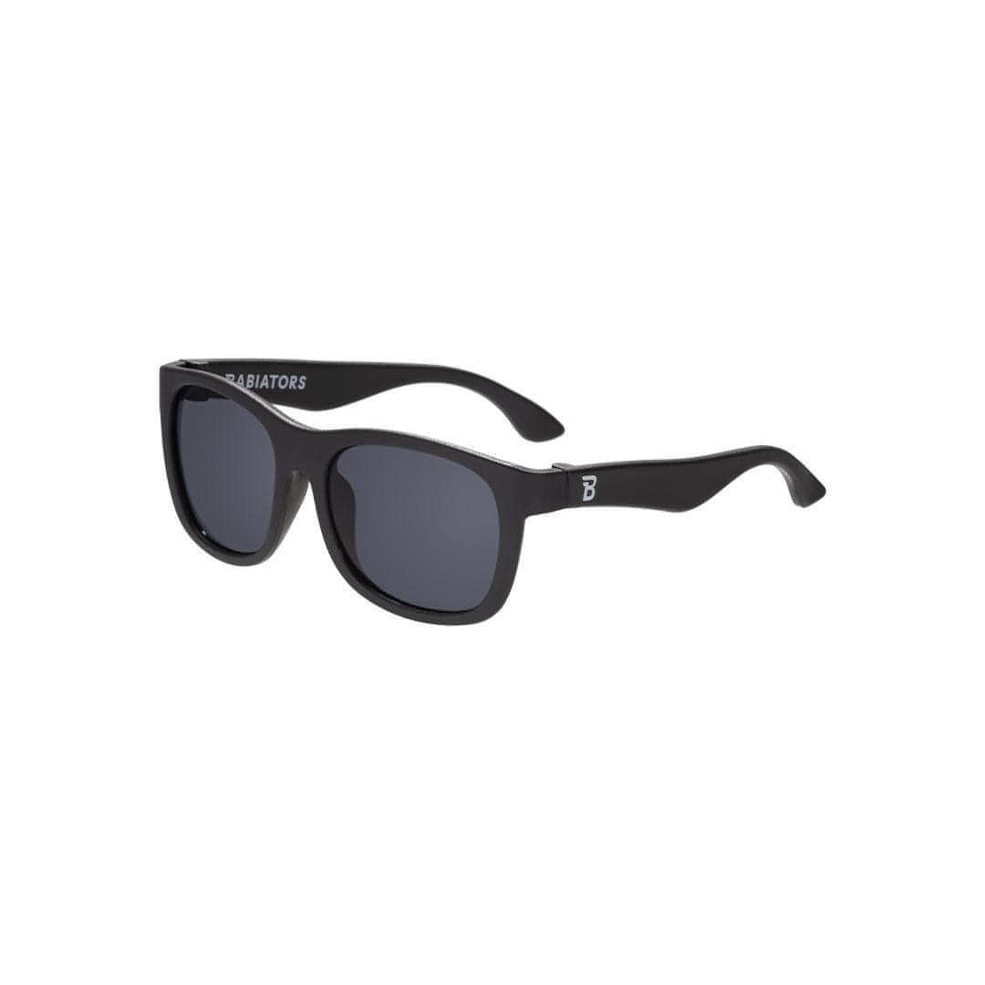 Babiators Kids Navigator Sunglasses in Jet Black – showing classic black flexible rubber frame design with impact-resistant UV protection lenses for children