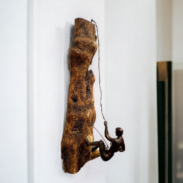 Handcrafted olive wood décor from ALTOE — elephant candle holder, rustic wall clock, and wall man figurine