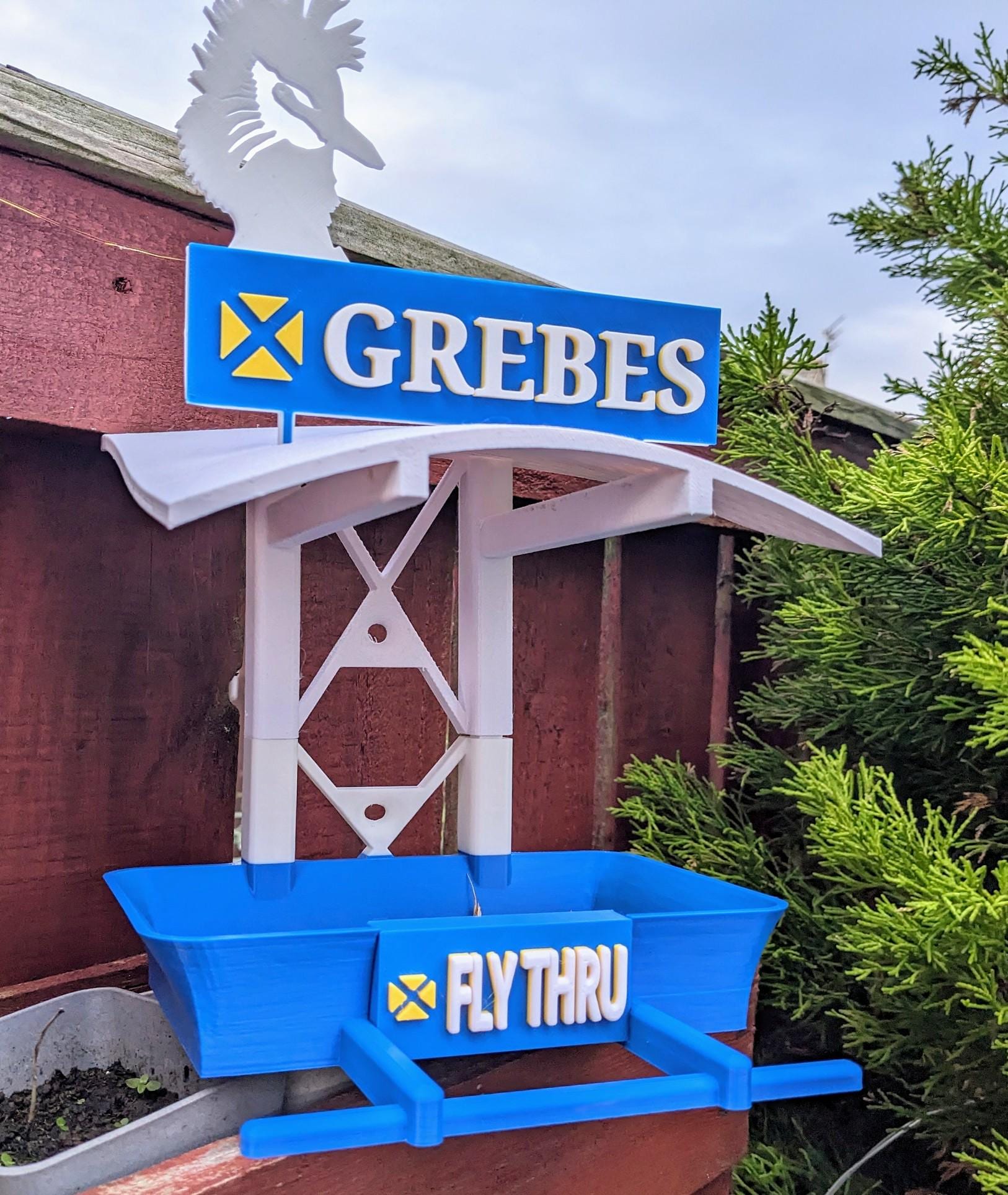 Chaddyverse Grebes Bakery Bird Feeding Station – quirky 3D-printed garden bird feeder designed to look like a miniature bakery shop for wild birds