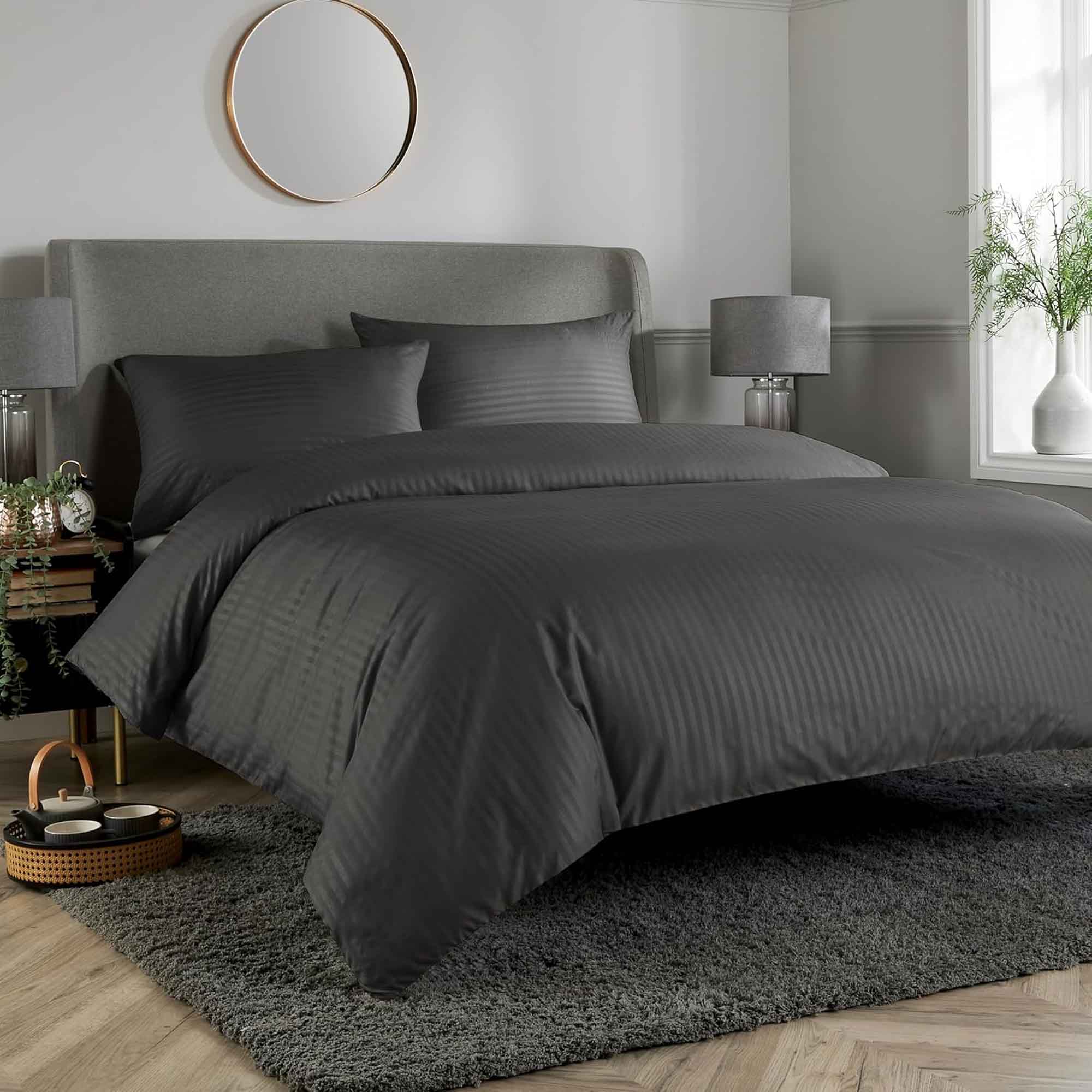 OLIVIA ROCCO Mayfair Satin Stripe Reversible Duvet Cover Set in sage green – shown dressed on a bed with matching pillowcases and comforter, hotel-quality finish