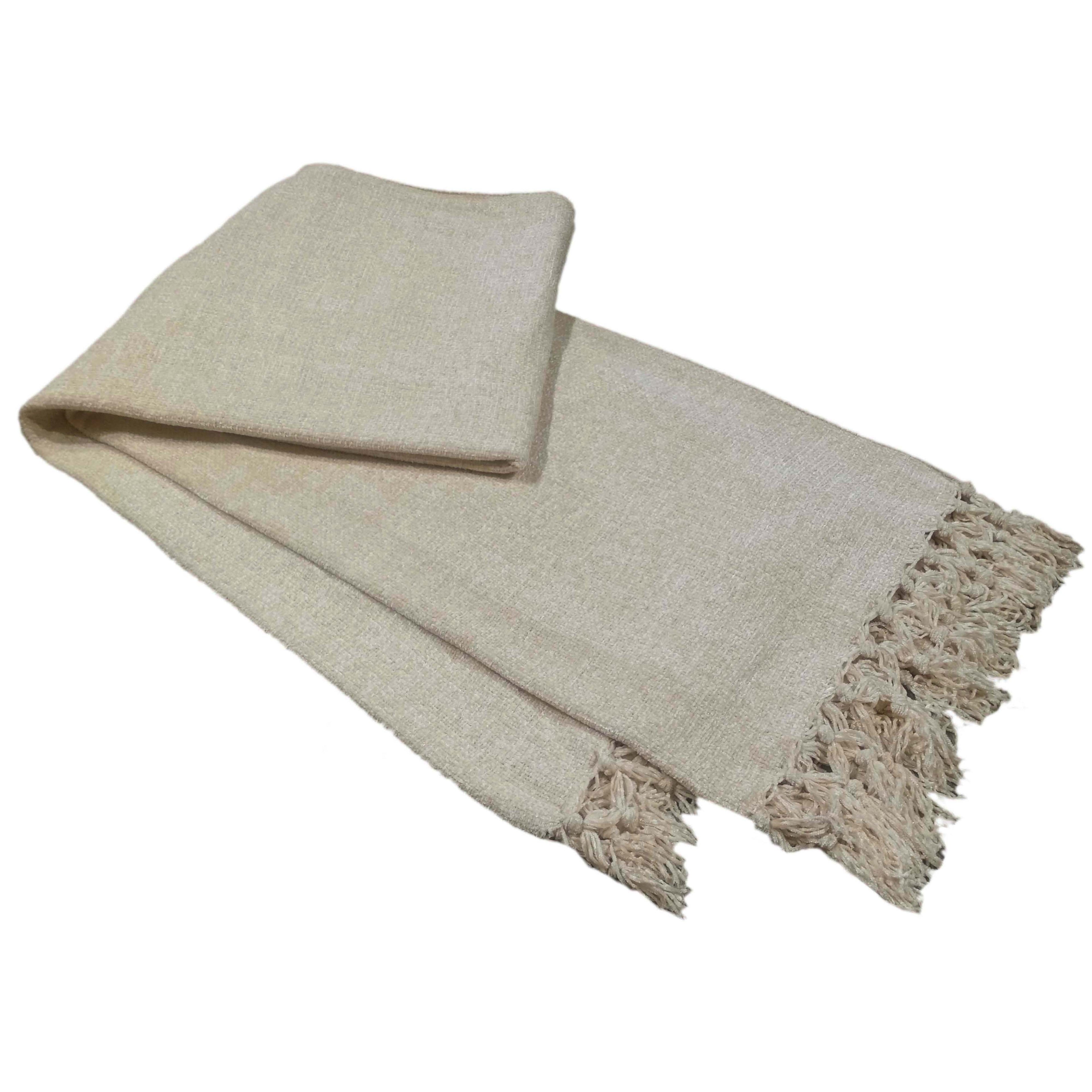 OLIVIA ROCCO Chenille Tassel Throw Blanket in charcoal draped over a sofa showing the soft chenille texture and decorative tassel trim