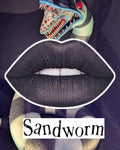 Radioactive Unicorn Sandworm Lipstick – Matte Black with Purple Shimmer