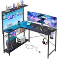 Bestier L-Shaped Gaming Desk with LED Lights and Power Outlets – 129cm