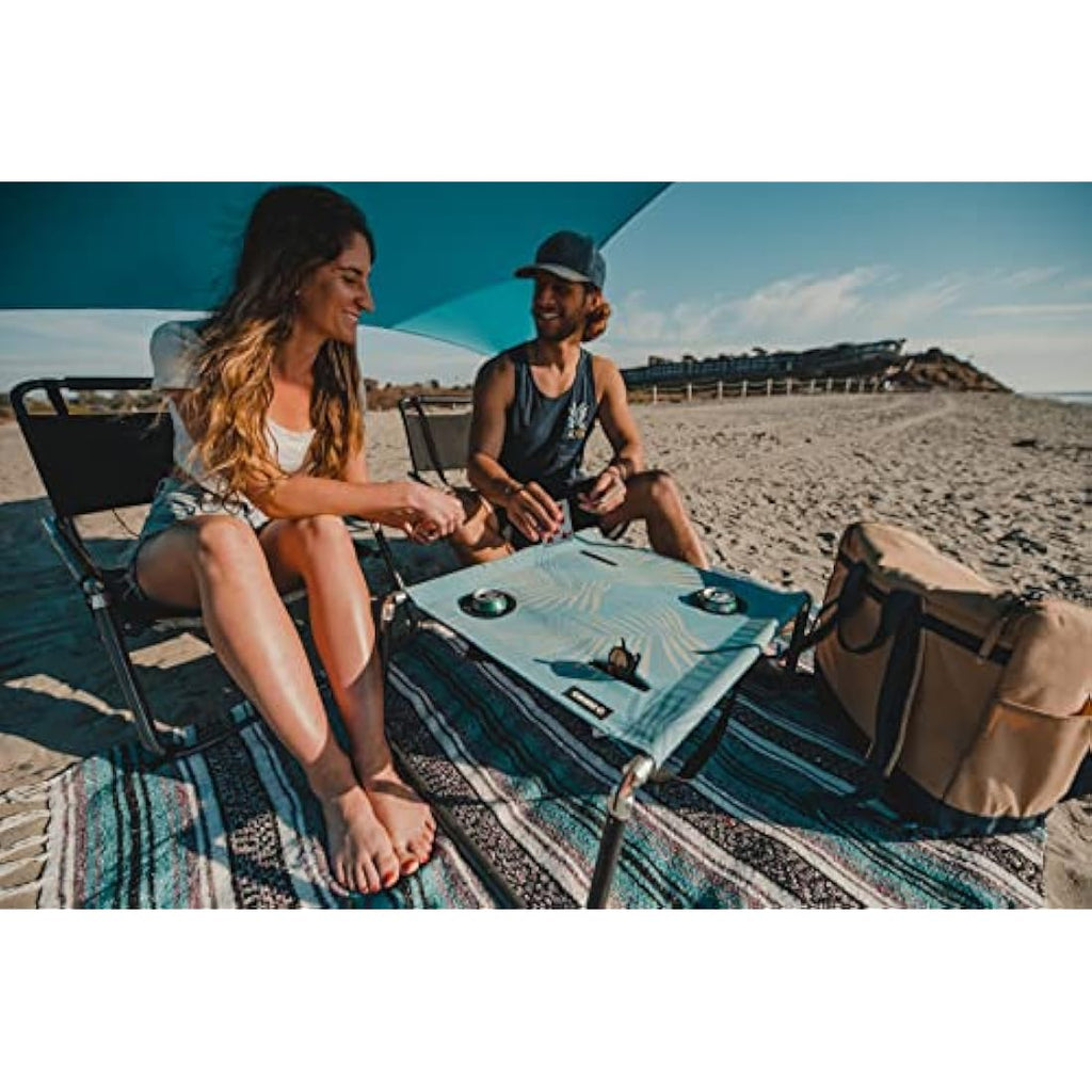 Neso Portable Beach Table | Lightweight Canvas Picnic Table - Aqua Fronds