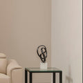 Orsina Mirano Knot Sculpture | Black Nickel & White Marble Base