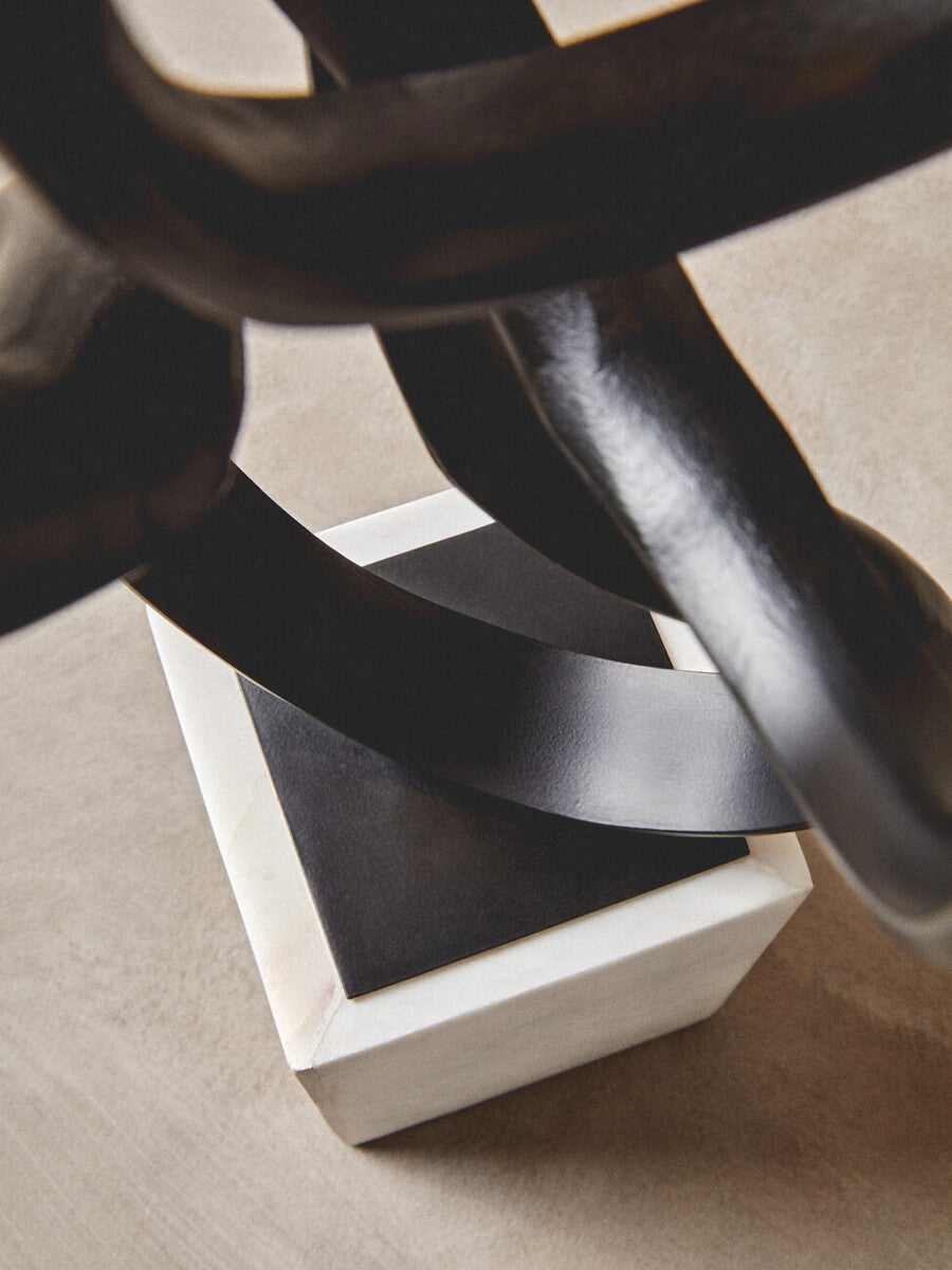 Orsina Mirano Black Aluminium Knot Sculpture on White Marble Base