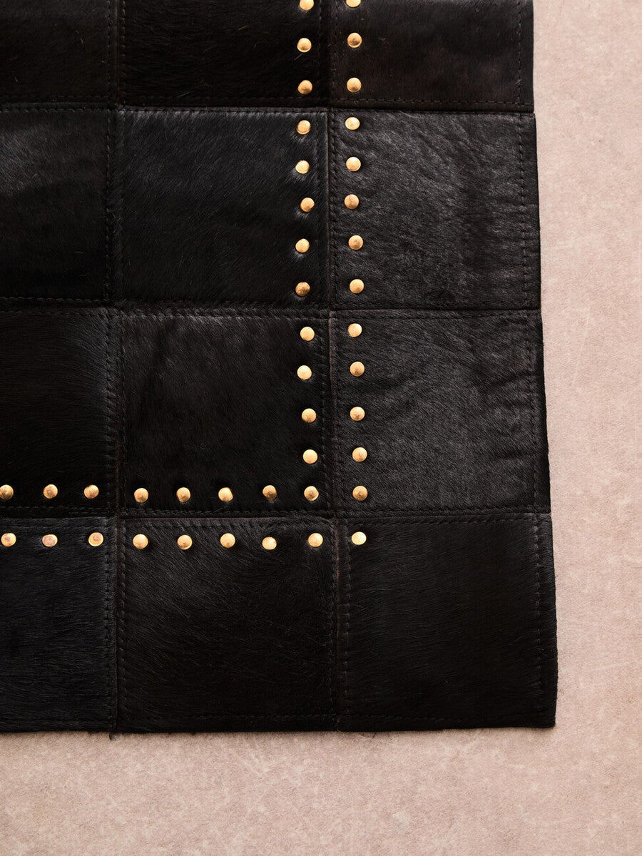Orsina Safira Small Black Hair on Leather Rug with Gold Studs