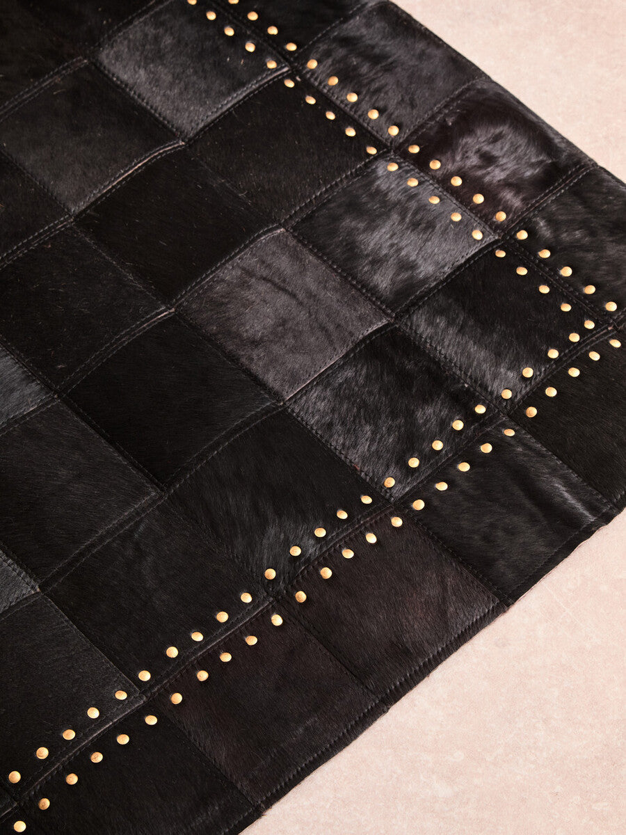Orsina Safira Small Black Hair on Leather Rug with Gold Studs