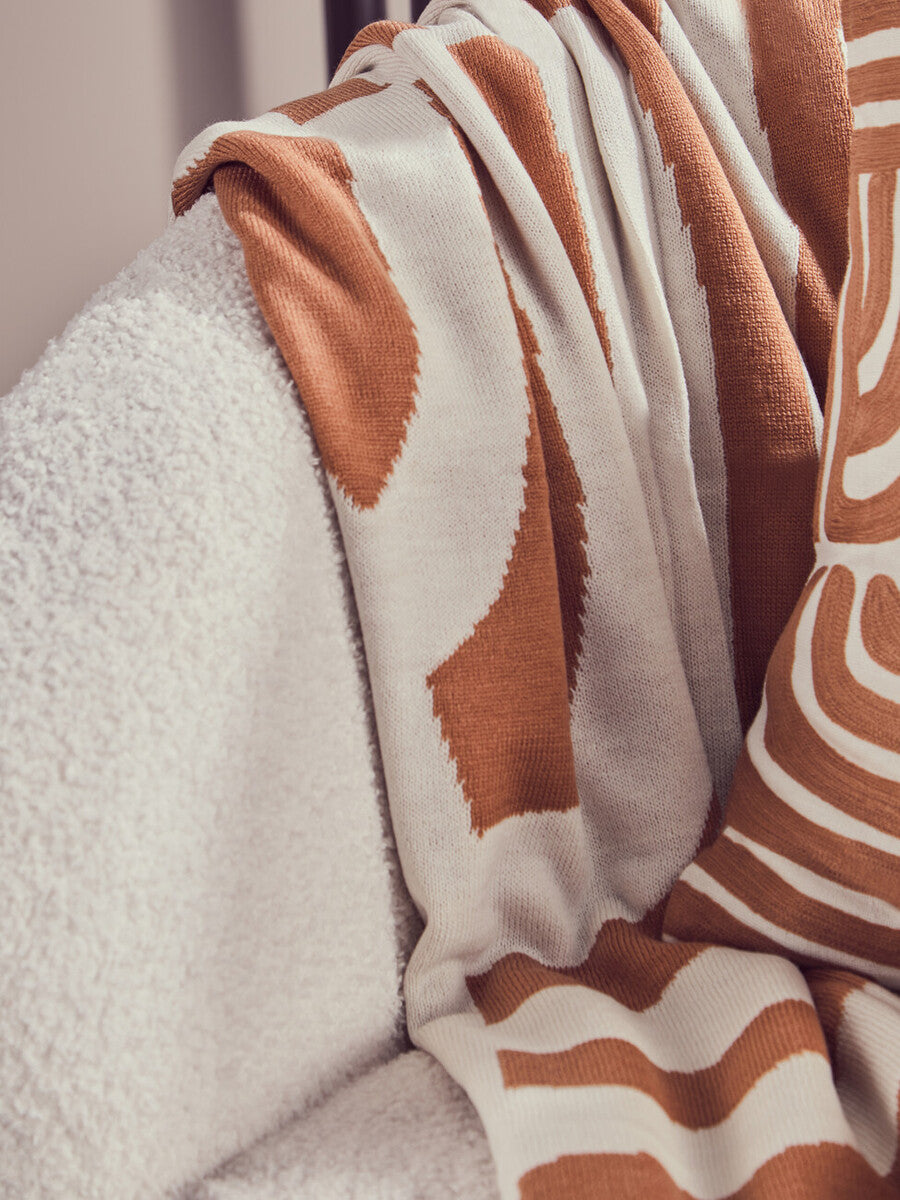 Orsina Bosie Ozella Knitted Throw – Natural and Terracotta Abstract