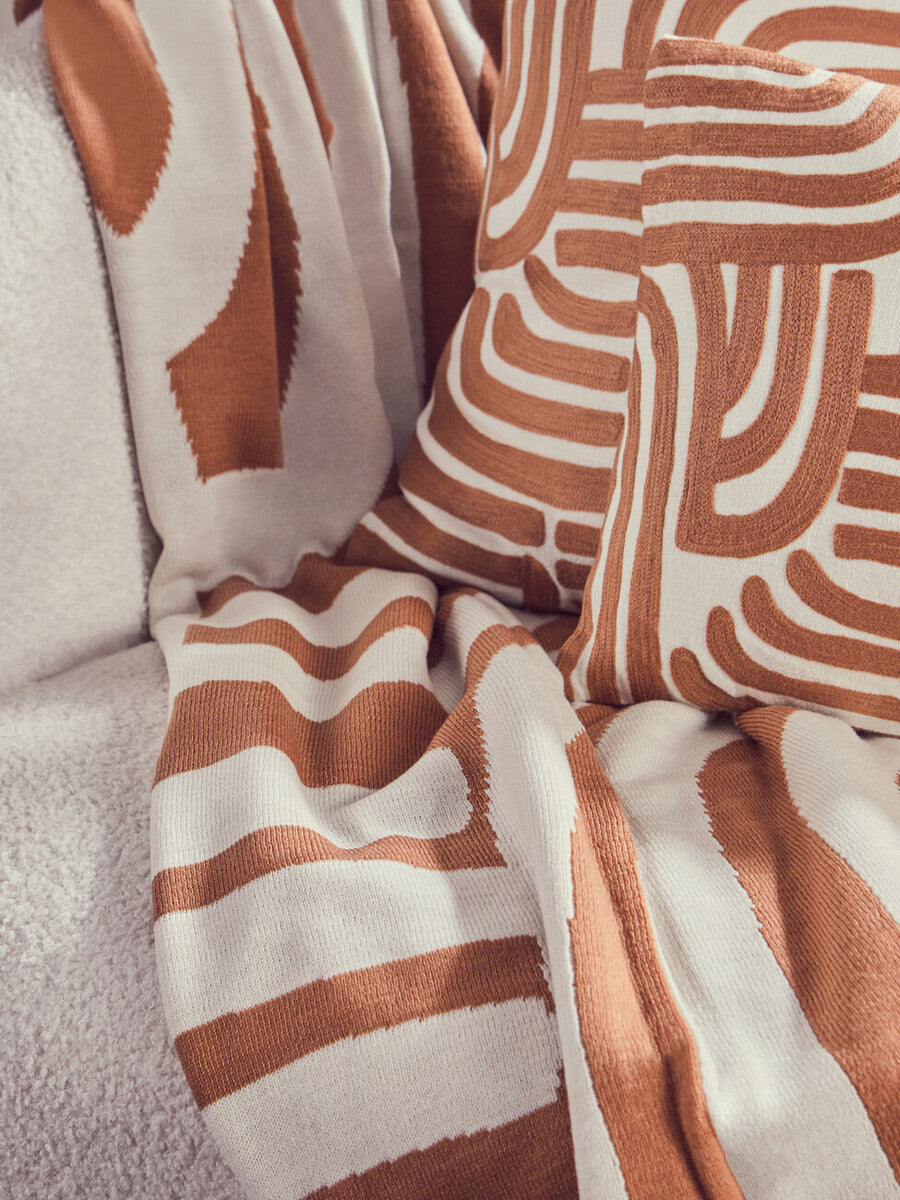 Orsina Bosie Ozella Knitted Throw – Natural and Terracotta Abstract