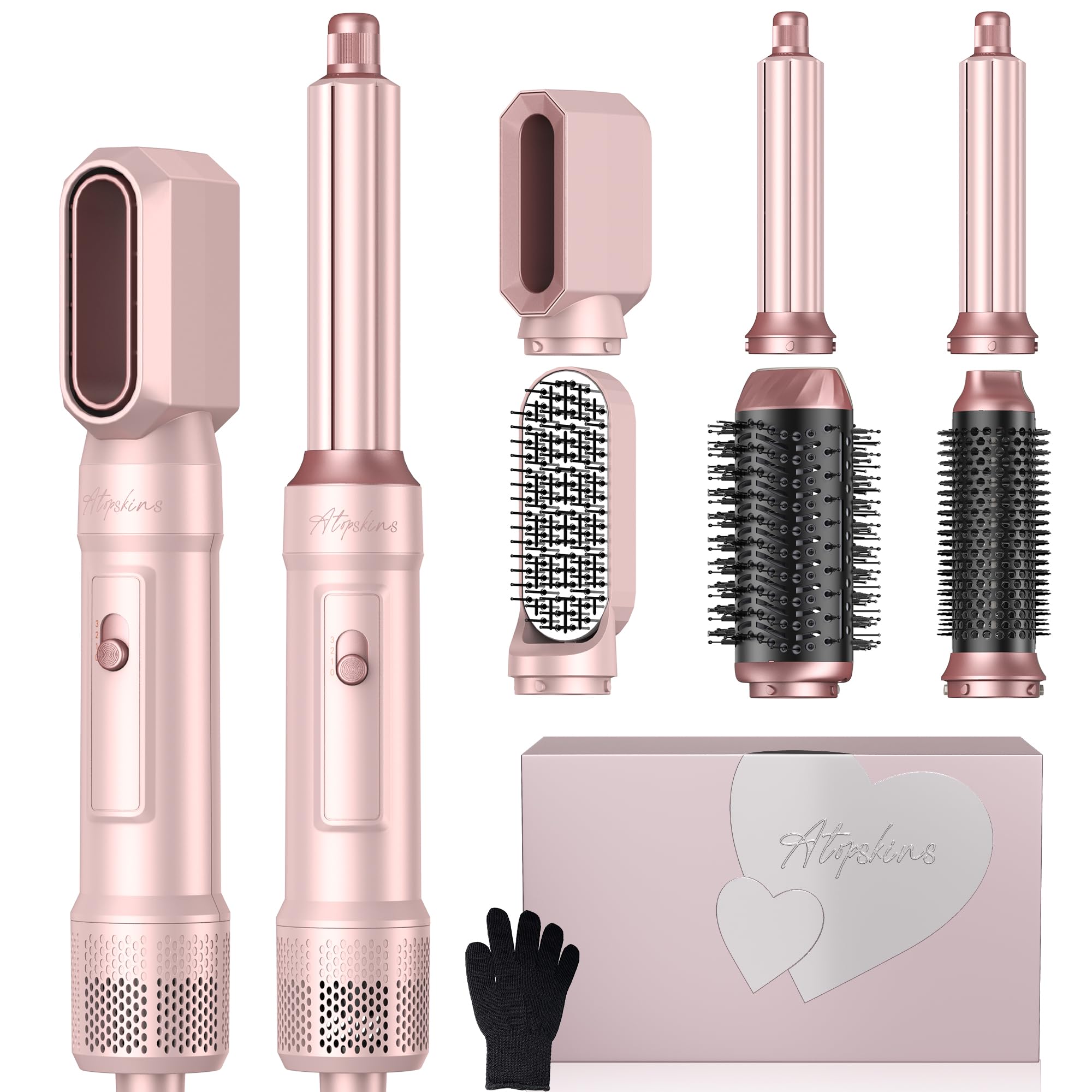 Rose gold hair styling tool set with attachments and packaging on a white background
