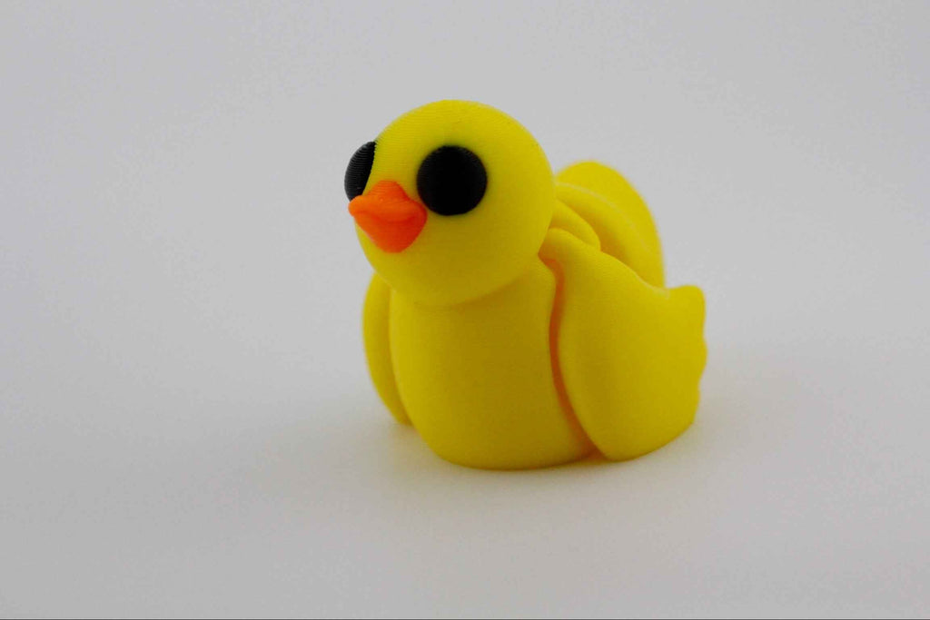 Yellow rubber duck toy on a white background