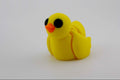 Yellow rubber duck toy on a white background