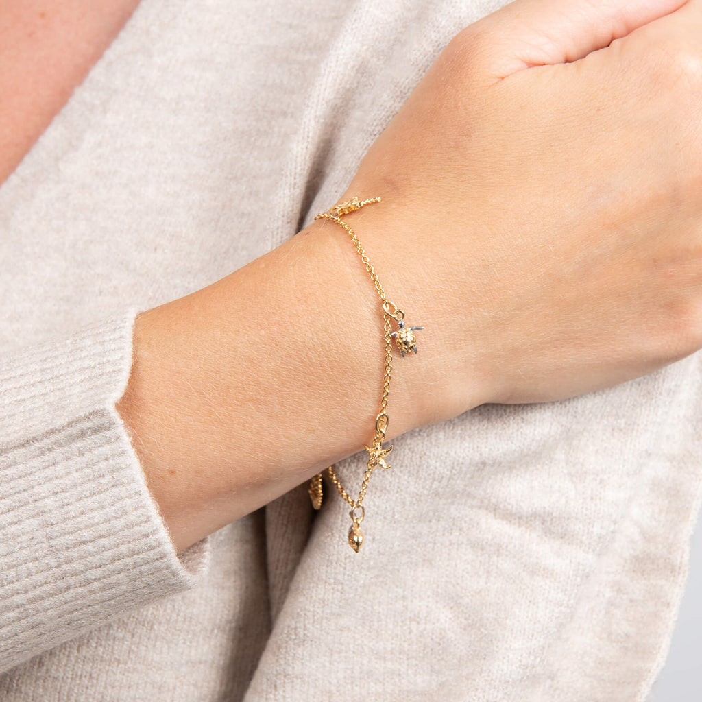 Laura Ashley Beach Charm Bracelet – Yellow Gold Plated Brass with Charms