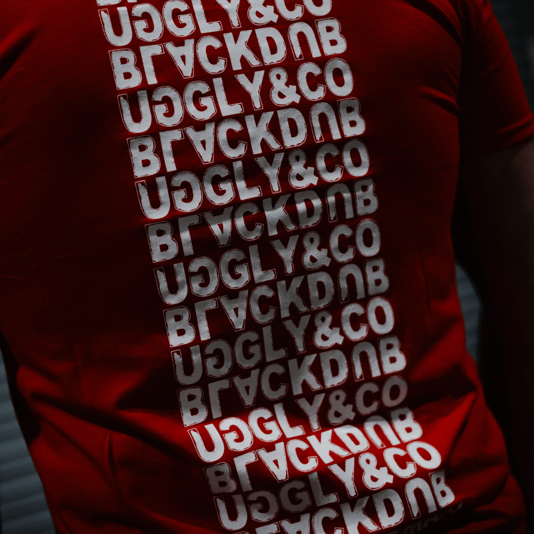 Uggly and Co Red Repeat Tee – Isle of Man TT Cotton Motorcycle T-Shirt