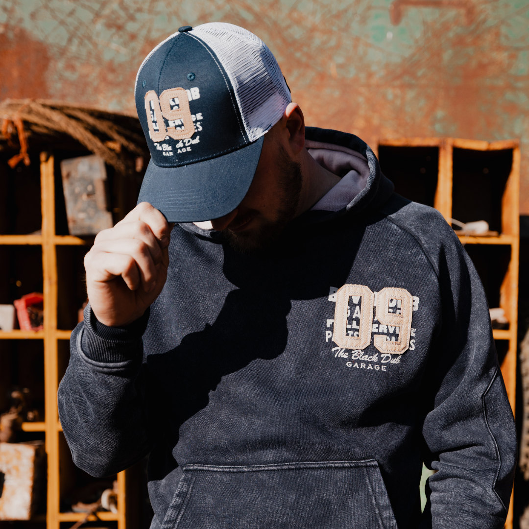 Uggly and Co Navy Parts & Spares '09' Vintage Moto Trucker Hat
